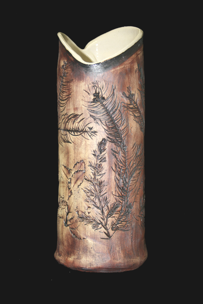 a pottery vase with leaf impressions made in our handbuilding class