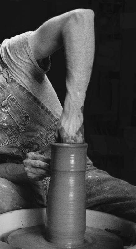 throwing a tall cylinder on the potters wheel
